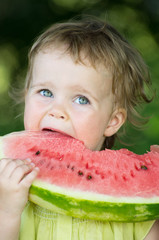 baby girl eating watermelon