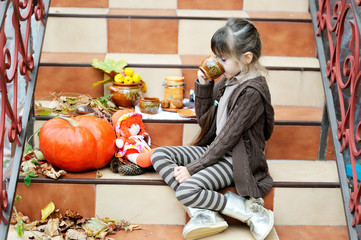 Little girl having a picnic on stairs