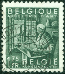stamp printed in Belgium, shows the lace-maker at work