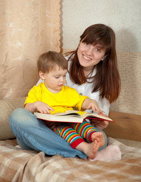 Mother and daughter reading  book