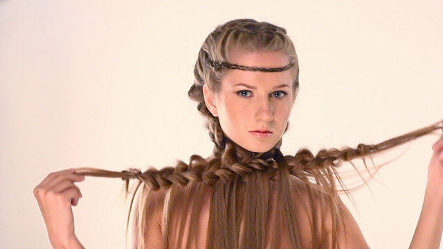 beautiful young blonde with creative braid hairdo