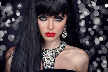 Beautiful Brunette Girl with long hair and red lips on glitter b