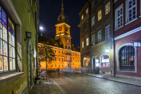 Old Town street at night with view to Royal Palace in Warsaw
