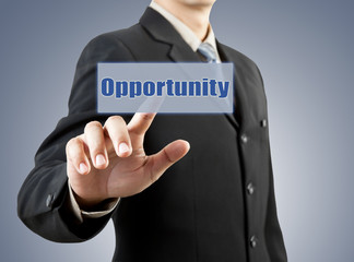 businessman hand pushing opportunity button