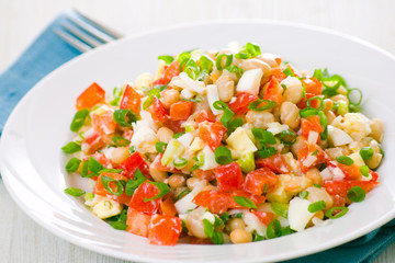 fresh vegetable salad with white beans, red pepper, tomato, egg 