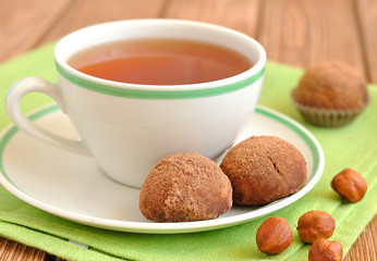 Cup of tea and cookies on a green napkin