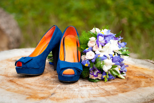Blue wedding accessories on wood