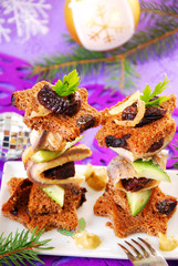 herring canapes with prune and gherkin for christmas