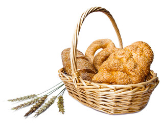 Basket with bread on white background