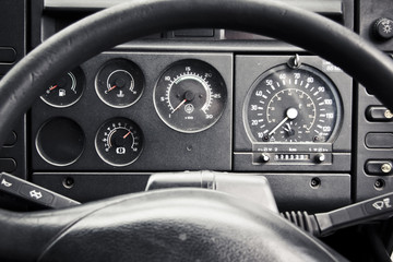 truck dashboard through steering wheel - Powered by Adobe