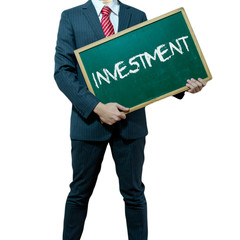 Business man holding board on the background with business word