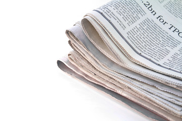 Various newspapers over white background
