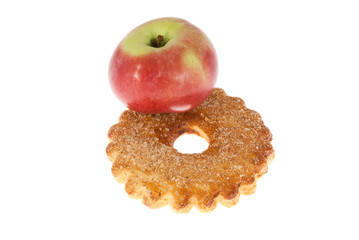 Delicious cake and apple on a white background