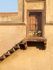 Stairway to locked sandstone door