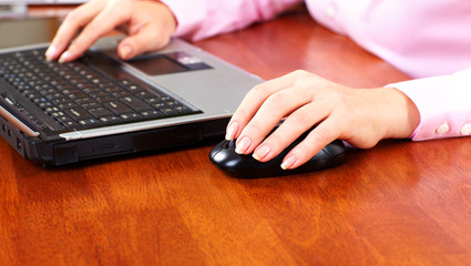 Hand with a computer mouse.