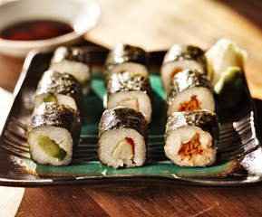 vegetarian sushi rolls with carrot, crab and avocado.