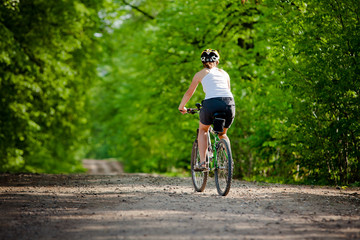 Fototapeta na wymiar Biker on the forest road