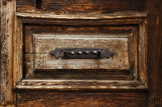 old wooden door with metal ornate background
