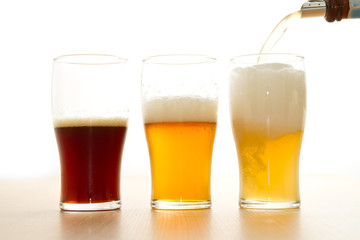 Three glasses with different beers  