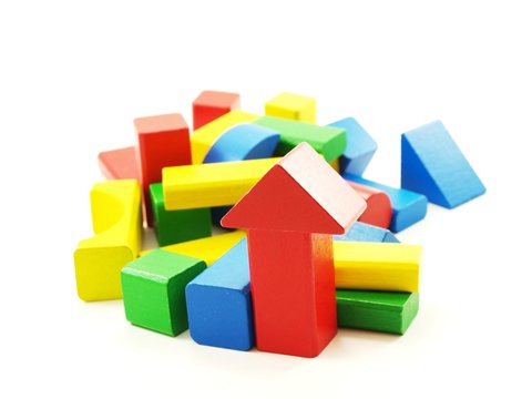 Pile of colorful wooden bricks, isolated towards white