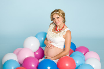 Fototapeta na wymiar Joyful young pregnant woman