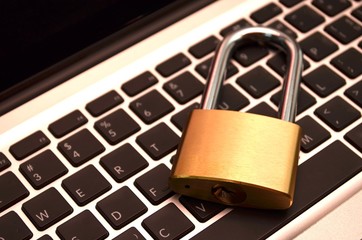 A padlock on keyboard. Data security and protection.