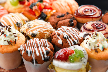 Colorful muffins in variety flavor topping