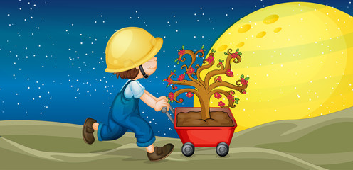 un garçon et un chariot avec une plante