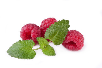 fresh raspberries with mint leaves isolated on white