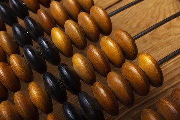 Fragment of old abacus close up