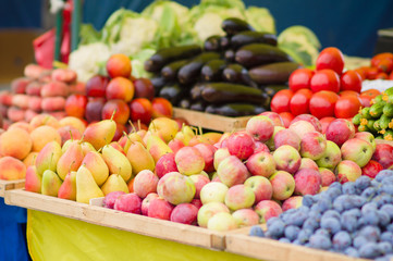 Pears, apples, plums, cucumbers, tomatoes, eggplants in city mar