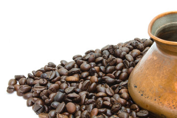 Coffee beans and a coffee maker on the white background