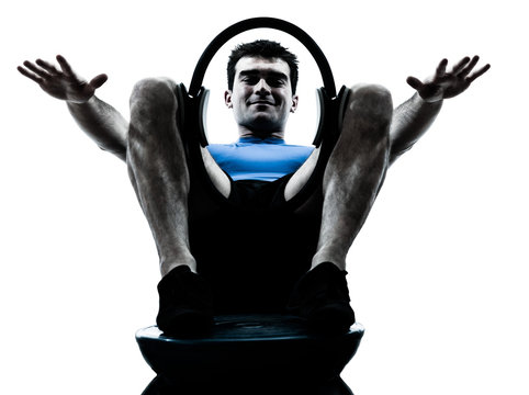 man exercising bosu pilates ring workout fitness posture