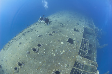 Scuba divers on a shipwreck