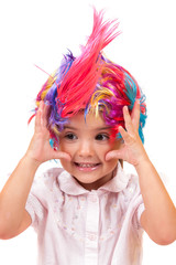 Little girl with colorful wigs