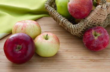 Red apples on wooden table