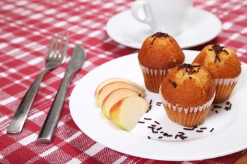 Three chocolate muffins served in restaurant