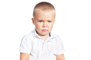 portrait of little upset boy isoalted over white