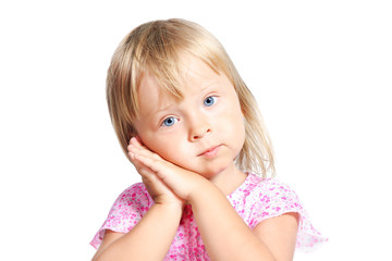 little blond girl with sleeping hands gesture isolated over whit