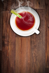 Top view of lemon tea on wooden plank table