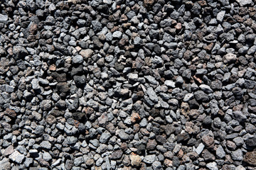 Black volcanic lava stones pattern texture