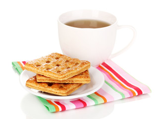 Cup of tea and cookies isolated on white