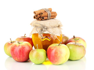 Honey and apples with cinnamon isolated on white