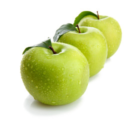 Ripe green apples with leaves  isolated on white