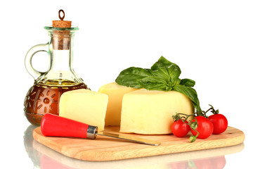 sliced mozzarella cheese with vegetables isolated on white