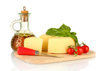 sliced mozzarella cheese with vegetables isolated on white