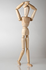wooden man with headache