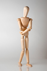 wooden man with stomach ache