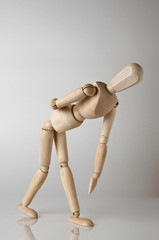 wooden man with backache
