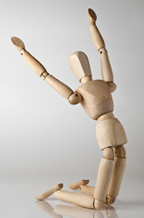 wooden man praying